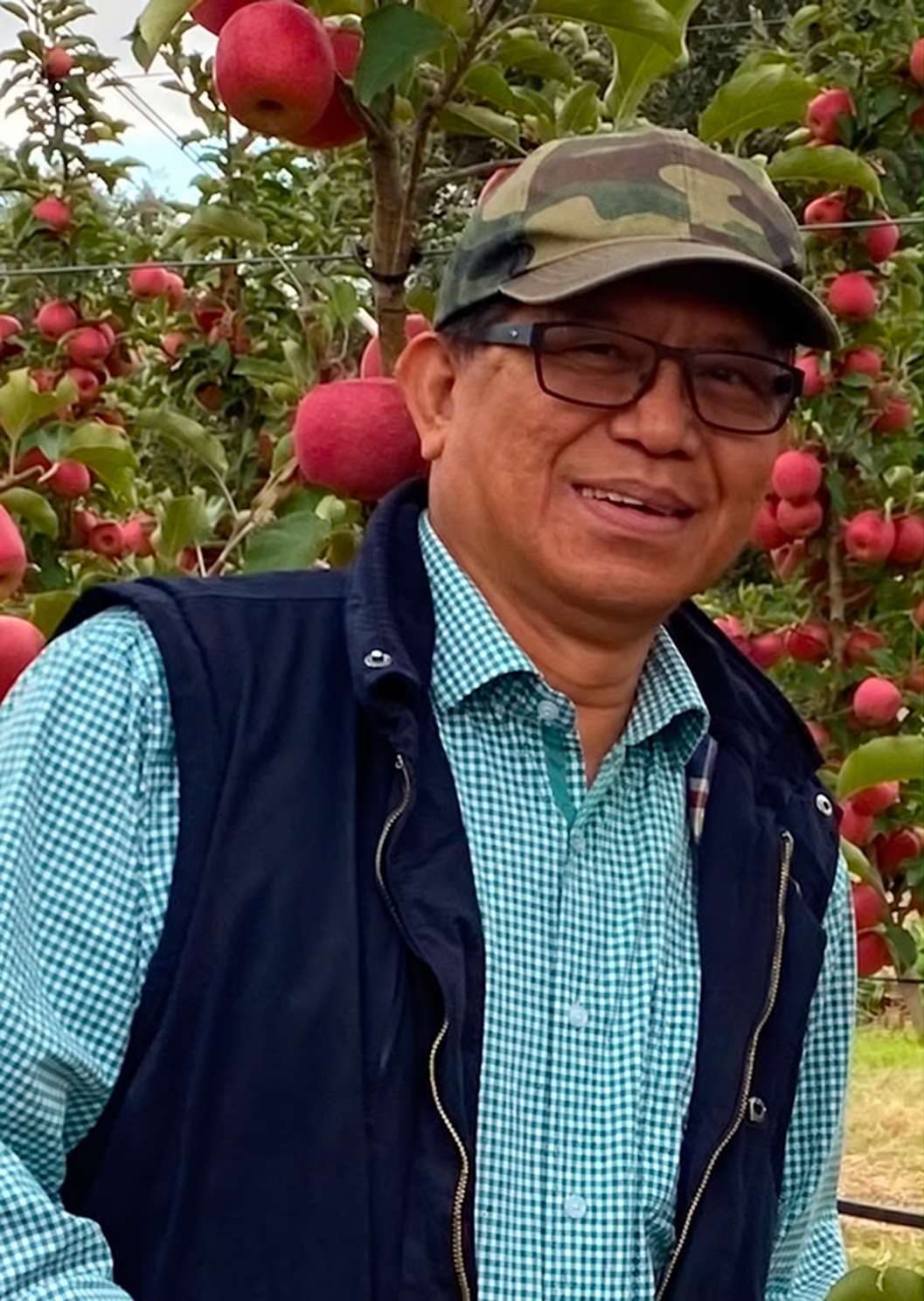 Valerio C. Tanguilig in an apple orchard